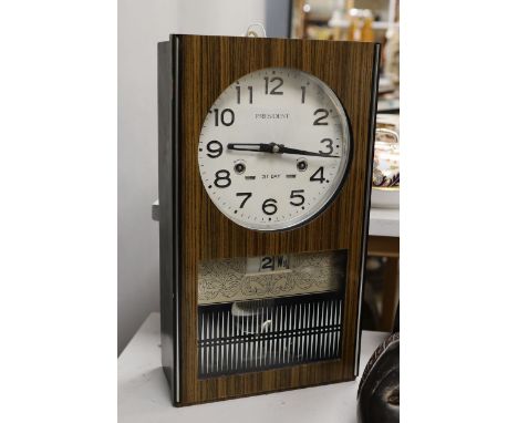 A 1970's President wall clock, 42 cms high.