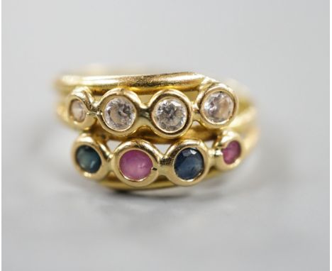 A modern Italian 750 yellow metal and collet set four stone diamond, two stone sapphire and two stone ruby set two row ring, 