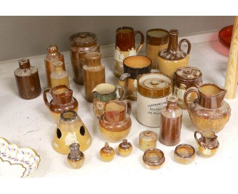 A quantity of Doulton stonewares including inkstand, jug, miniature salts and 19th century saltglaze pottery bottles, tallest