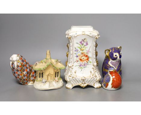 Three Crown Derby animal paperweights, a pastel burner cottage and a Continental gilt and floral decorated vase,  tallest ite