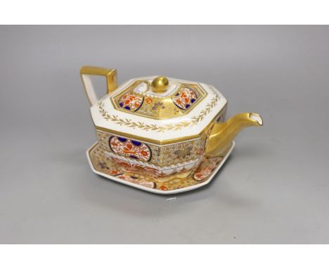 A Spode teapot cover and stand painted with Imari pattern, 1495, c.1820, 24.5 cm long