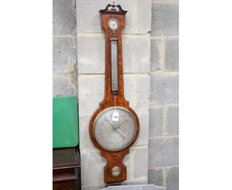 P Salmoni of Bath. A Regency ebony strung mahogany wheel barometer, height 110cm