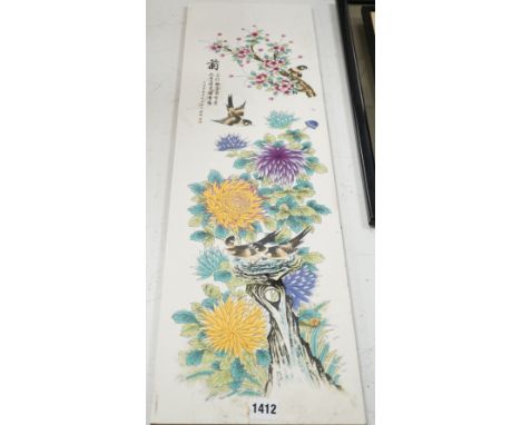 A Chinese enamelled tile, decorated with birds and flowers, 75 cms high x 22 cms wide.