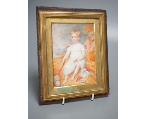 A 19th century portrait miniature on ivory of an infant, with racket and ball, 10 cms wide x 14 cms high.