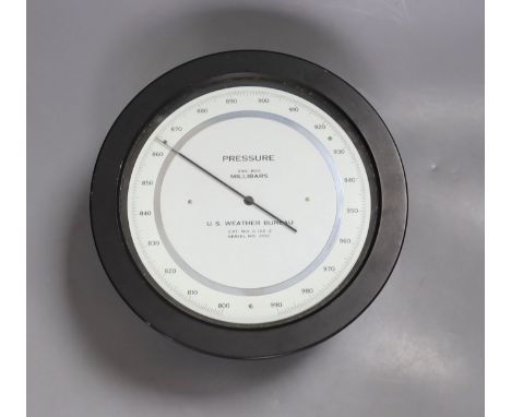 A U.S. Weather Bureau barometer , millibars 990-800, serial number 2052, 21 cms diameter.