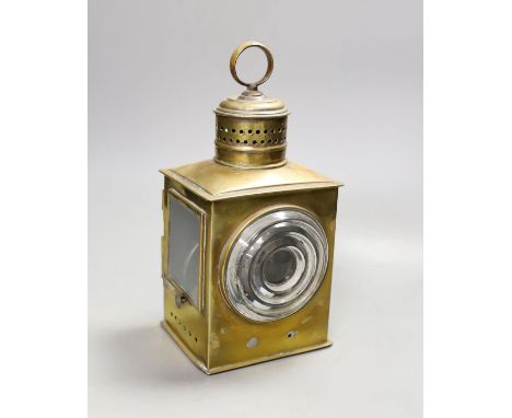 A 19th/20th century brass railwayman's lamp, 26 cms high.