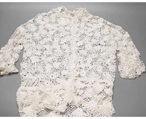 A 19th century hand made Irish crochet jacket, with long sleeves and high collar, a bobbin lace and white worked patch worked