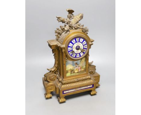 A 19th century French gilt metal and porcelain mantel clock, 36cm high