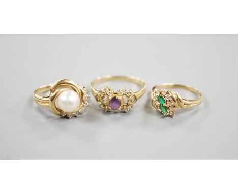 Three assorted modern 14k yellow metal and gem set dress rings, including cultured pearl and diamond, gross weight 10 grams.