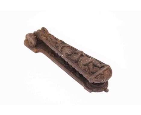 Victorian cast iron door knocker by Archibald Kenrick &amp; Co having a decorative cast cherub playing a flute, 22cm long
