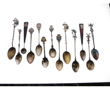 Group of white metal and unmarked souvenir spoons, to include 800, 830, enamel and other examples