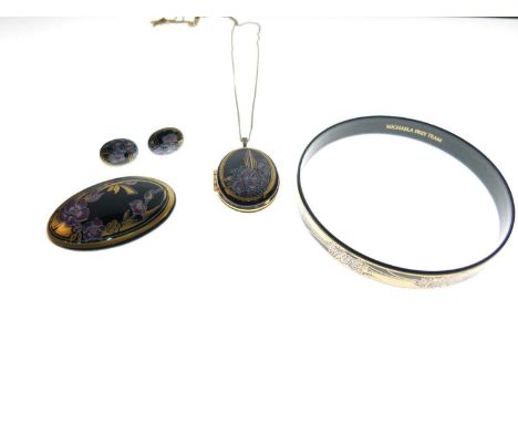 Suite of Michaela Frey black and gold enamel jewellery comprising bangle, locket, brooch and stud earrings (4)