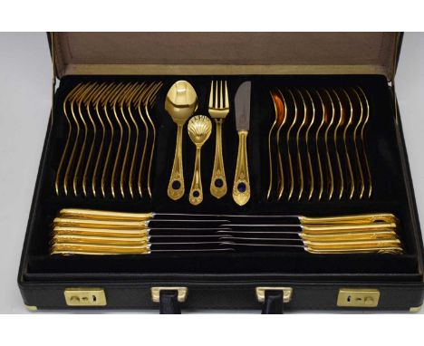 Cased twelve person gilt Royal Collection Solingen cutlery with serving ladle, spoons etc