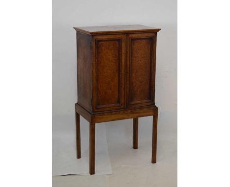 Edwardian pollard oak veneered cabinet, the fielded panel doors enclosing single shelf interior, on associated stand, 64cm x 