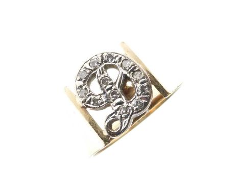 Yellow metal (14K) initial ring, set with twelve (of 13) small stones in cursive initial 'D', approx size K, 4.5g gross appro