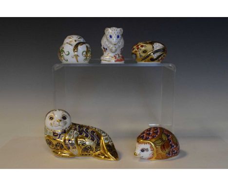 Five Royal Crown Derby paperweights, to include seal, dormouse, hedgehog, etc., three with gold button, 12cm diameter and sma