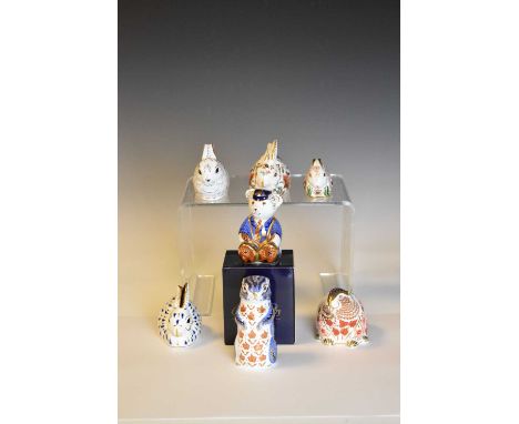 Seven Royal Crown Derby paperweights, comprising meerkat, beaver, teddy bear and three rabbits, all with gold buttons; togeth