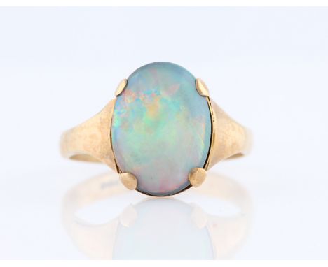 An opal doublet ring, set with an oval opal doublet measuring approx. 15x11mm, stamped 9ct, ring size U.