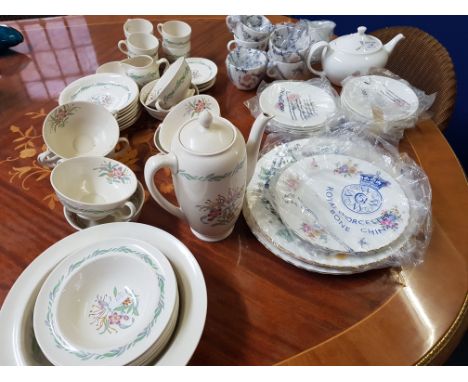 A collection of tea and dinner ware including Wedgwood, Royal Doulton, Royal Worcester and pair of candlesticks.