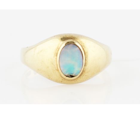 A single stone opal ring, set with an oval cut opal cabochon, set in unmarked yellow metal, ring size M (ring body not round)