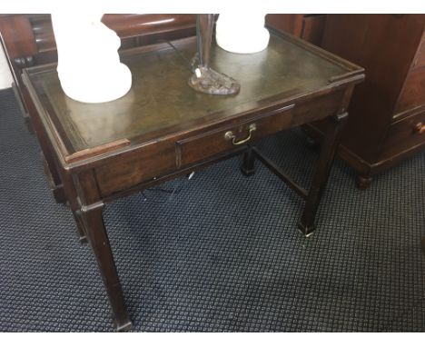Small oak writing desk with green leather insert.