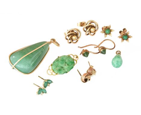 A jade and seed pearl brooch, stamped '15CT', length 2.9cm; an aventurine quartz pendant; a mottled green glass pendant; thre
