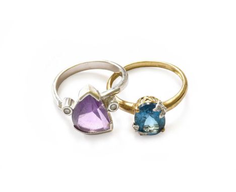 A 9 carat white gold amethyst and diamond ring, finger size O; and a 9 carat gold blue topaz and diamond ring, finger size RG