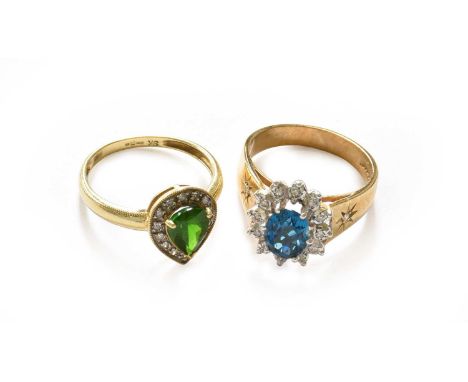 A 9 carat gold peridot and diamond cluster ring, finger size O1/2; and a 9 carat gold blue topaz and diamond cluster ring, fi