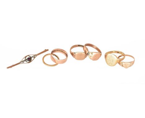 Two 9 carat gold signet rings; two 9 carat gold band rings; a signet ring, stamped '9CT'; another signet ring, unmarked; toge