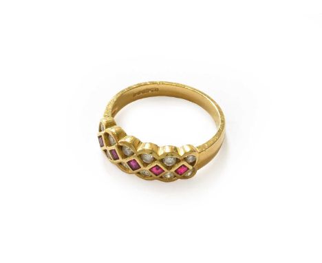 An 18 carat gold ruby and diamond half hoop ring, finger size M1/2Gross weight 3.9 grams.