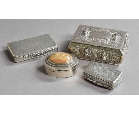 A collection of four silver boxes, two oblong, one reeded the other engine-turned, one oval and with hard stone set hinged co