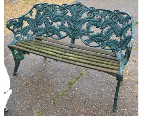 An antique Coalbrookdale fern design garden bench with woodslat seat, in old painted finish Condition Report old painted surf