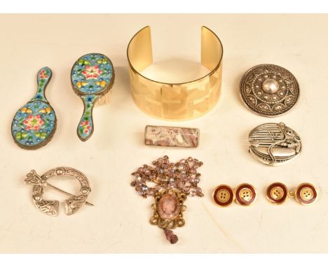 A collection of jewellery including Krug bangle, silver brooches including Robert Alliston, silver gilt cufflinks set with en