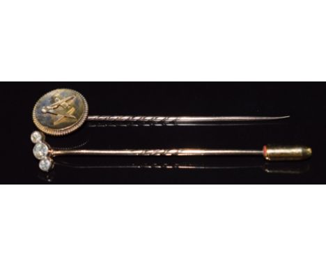 Masonic yellow metal&nbsp;stick pin and a 9ct gold stick pin set with three diamonds, 3.3g&nbsp;