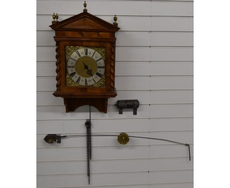 Edm Clement, Exon hooded wall clock, probably converted from a longcase clock, the brass dial with Roman numerals, single han