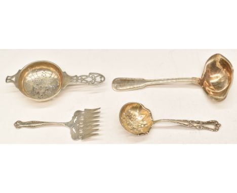 Hallmarked silver tea strainer, white metal sifter spoon or strainer marked Sterling, similarly marked cake fork and a ladle 