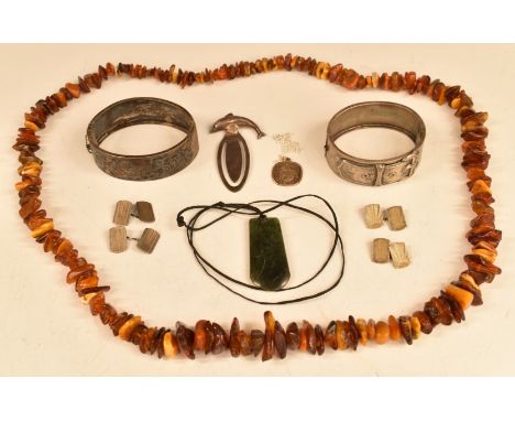 A group of silver items including two bangles, bookmarks and cufflinks, a nephrite jade pendant and an amber necklace&nbsp;