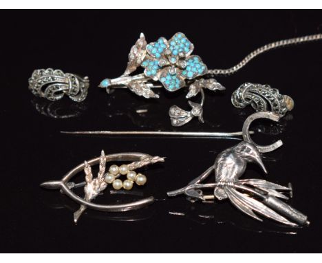 A silver brooch set with turquoise and seed pearls, two silver brooches, horseshoe stick pin and a pair of silver and marcasi