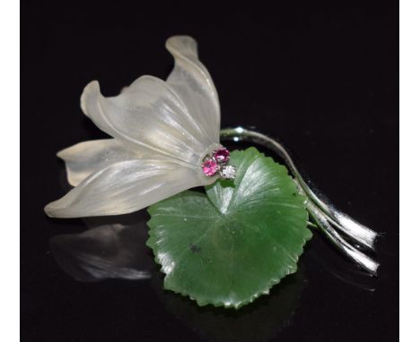 A 14k white gold brooch in the form of a lily set with nephrite jade, quartz, rubies and a diamond, 13.8g, 4.8cm
