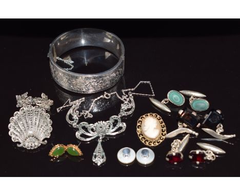 A collection of silver jewellery including bangle, brooch, cufflinks set with garnets, smoky quartz and malachite, marcasite 