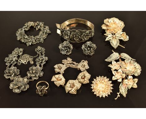 A suite of silver filigree jewellery comprising bangle, bracelet, earrings, ring and necklace together with three floral silv