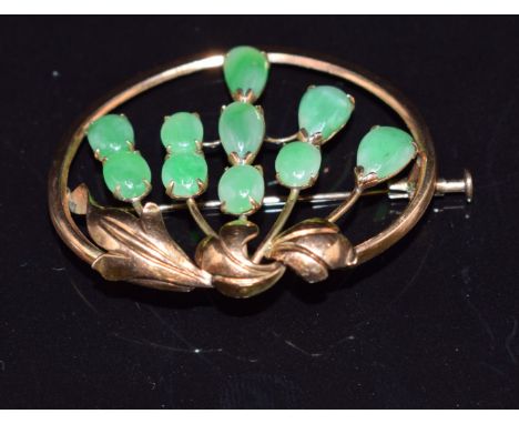 A 14k gold continental brooch set with jade cabochons, 3.8 x 3.1cm&nbsp;