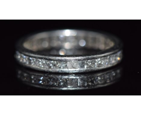 An 18ct white gold eternity ring set with thirty princess cut diamonds totalling approximately 1.5ct, 4g, size K