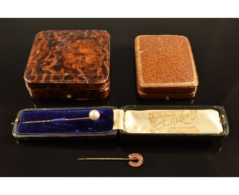 A yellow metal stick pin set with a pearl, in box, a horseshoe stick pin and two vintage jewellery boxes&nbsp;