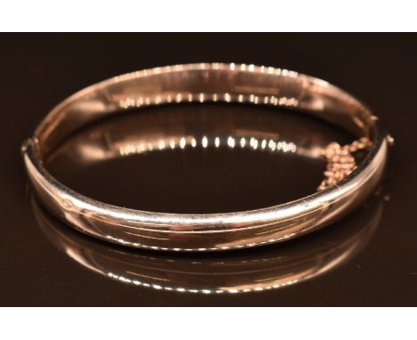 A yellow metal bangle, 12.1g, 6 x 5cm