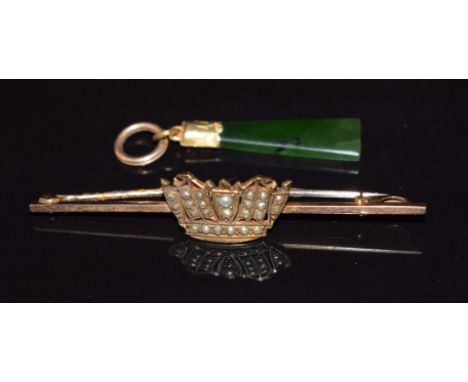 A 9ct gold brooch in the form of a coronet set with seed pearls and a 9ct gold pendant set with nephrite jade&nbsp;