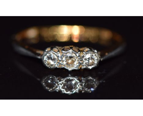 An 18ct gold ring set with three diamonds,1.8g, size K