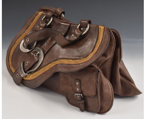 A vintage Christian Dior leather ladies bag with metal buckles in the form of stirrups
