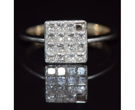 An 18ct white gold ring set with princess cut diamonds in a square setting, 3.6g, size K