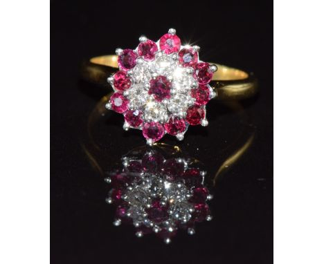 An 18ct gold ring set with diamonds and rubies in a cluster, 4g, size K